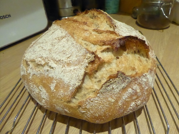 Freshly baked bread on a kitchen worktop.
